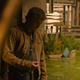 Pedro Pascal's Joel looks down at his hand in a scene from HBO's The Last of Us.